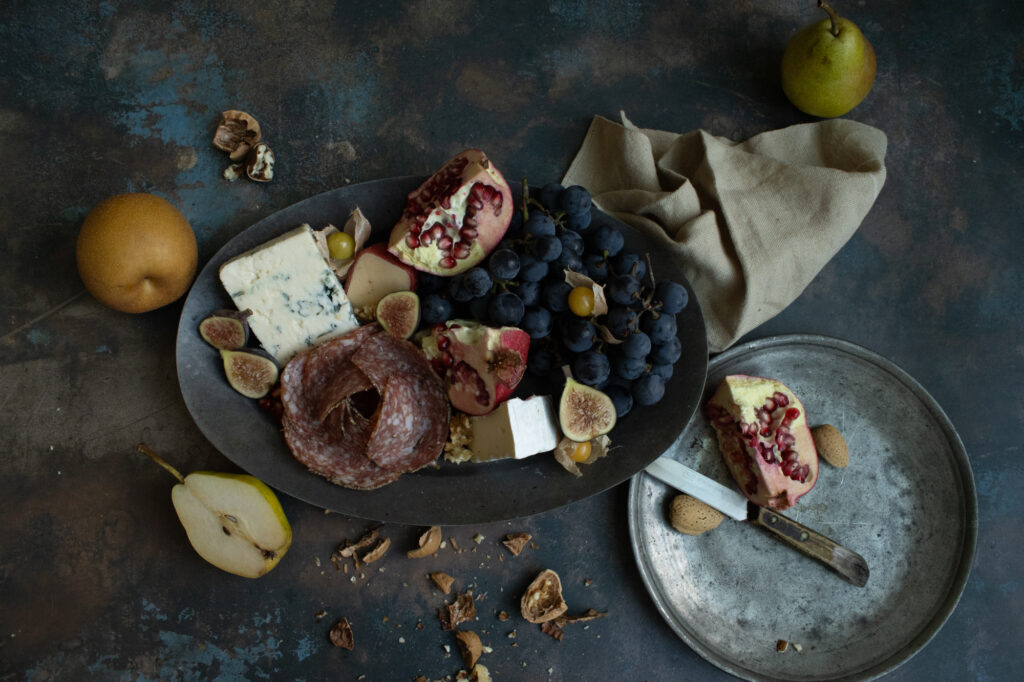 Charcuterie board with fruits and cheese